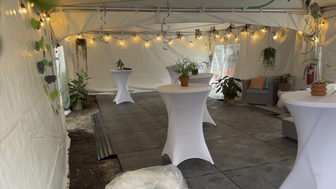 Lighted event space with cocktail tables for a Hampton Roads school dance